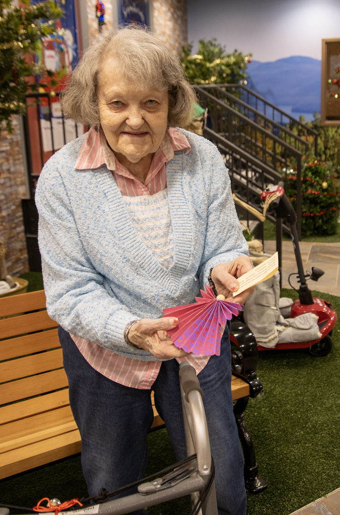 resident shows off her ornament