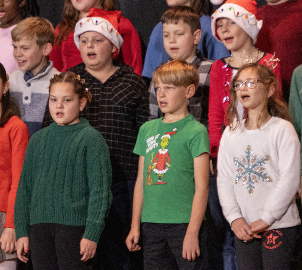students sing on stage