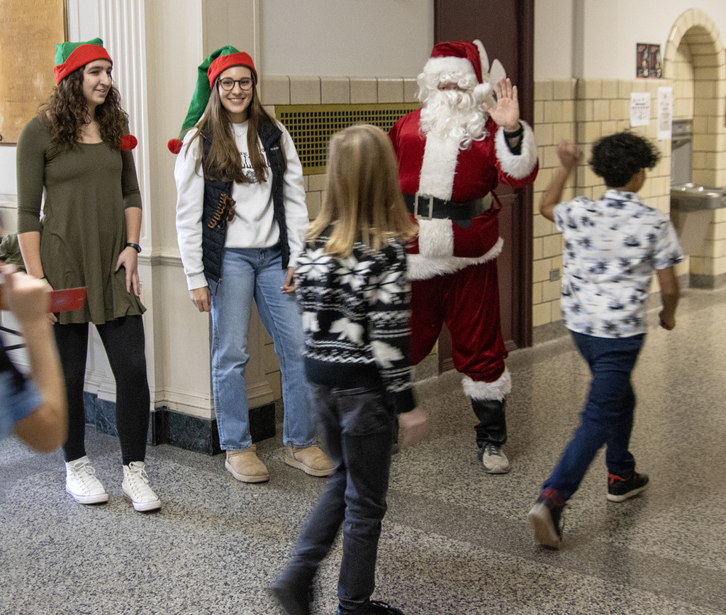 santa high fives students