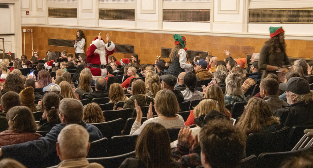 Santa and his elves in auditorium