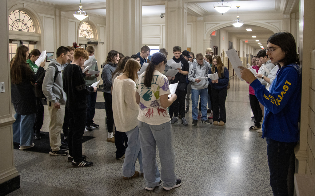 German students singing in the high school lobby