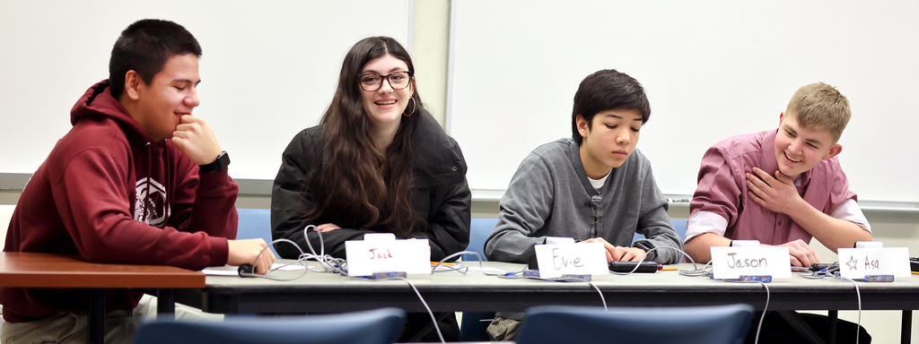 The Dleaware Academy team at the competition table