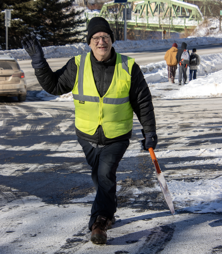 Mr. Staples holding stop sign