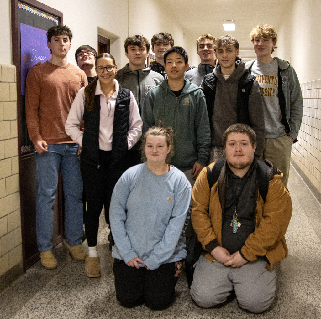 11 high school student pose for a group photo