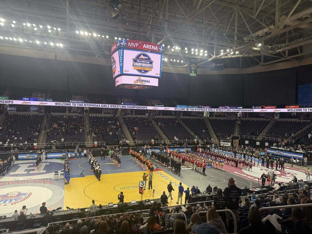 MVP Arena with all the girl wrestlers lined up in rows by section