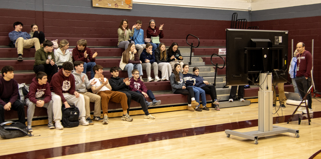 students and staff watching Cadence on the screen