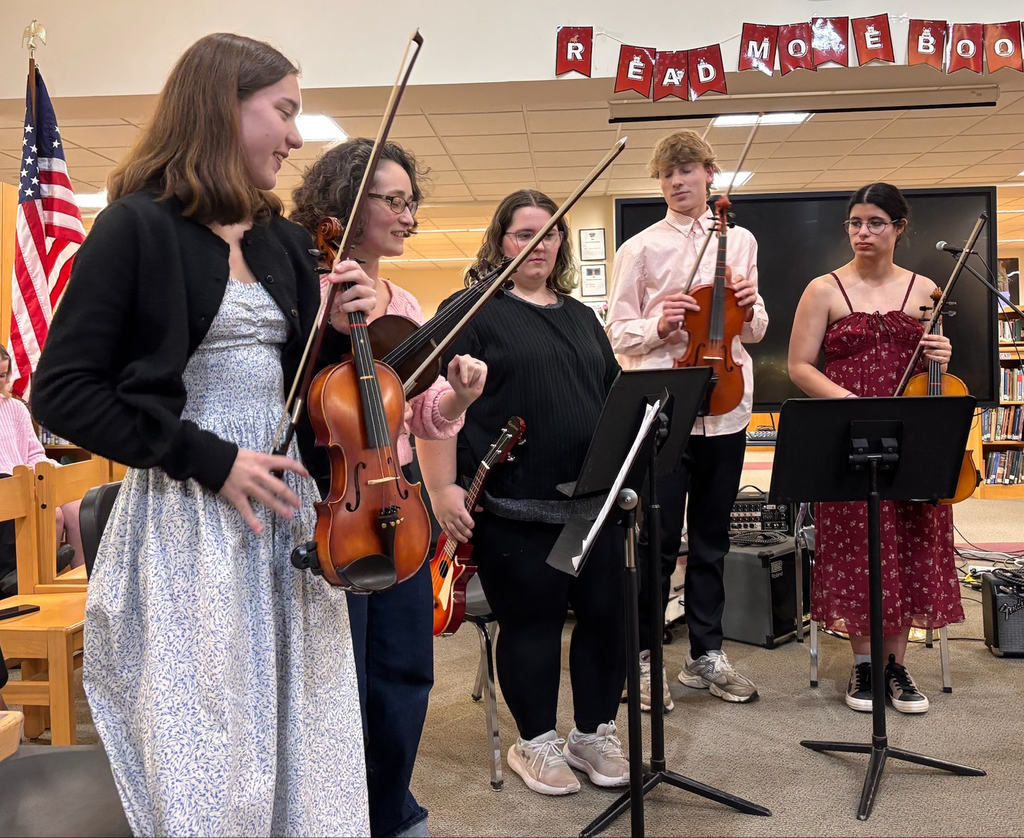 4 students and a teacher in a string ensemble