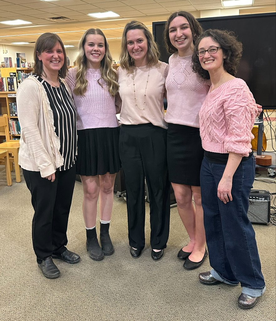 two students pose with two music teachers and the principal