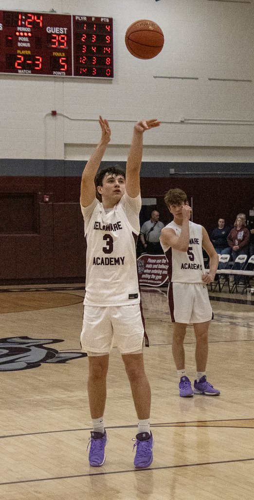 boy shooting foul shot in game