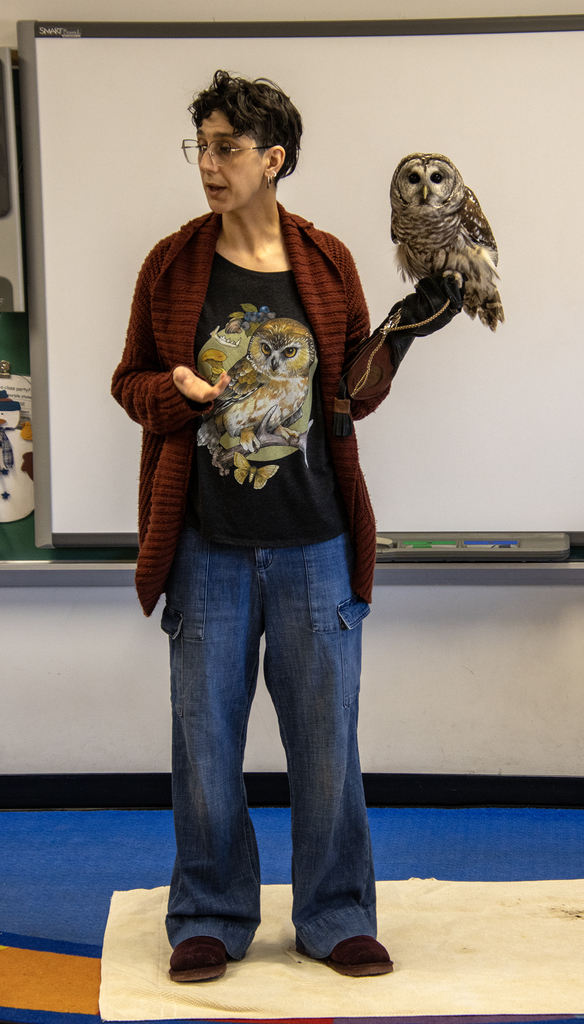 Mellow the owl and Genevieve Salerno visiting a classroom
