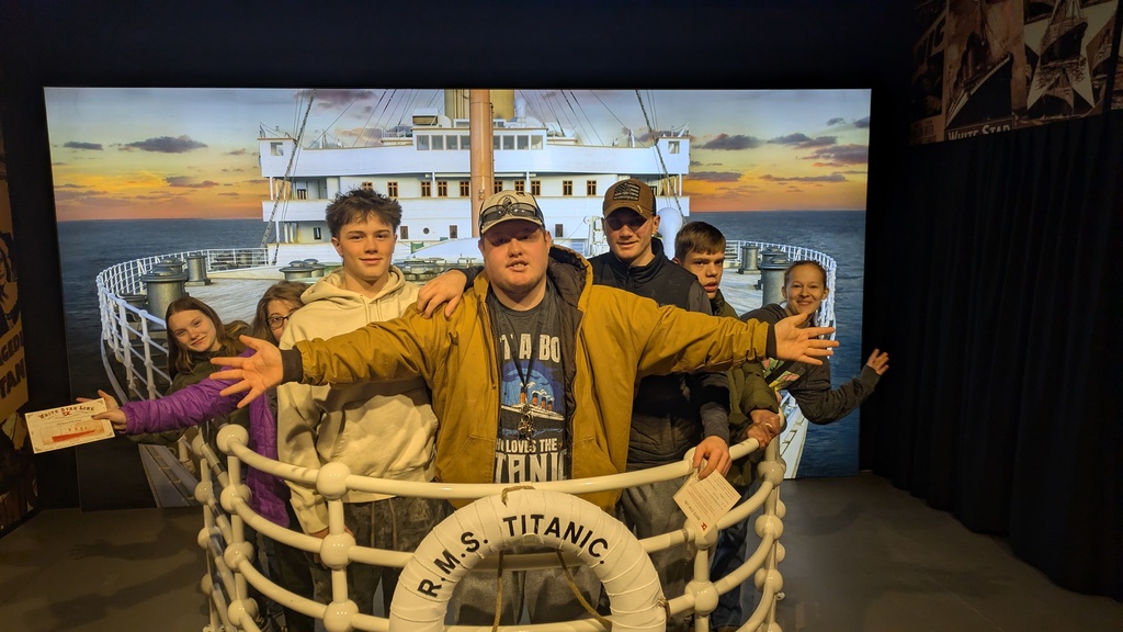 students pose on the bow of the titanic