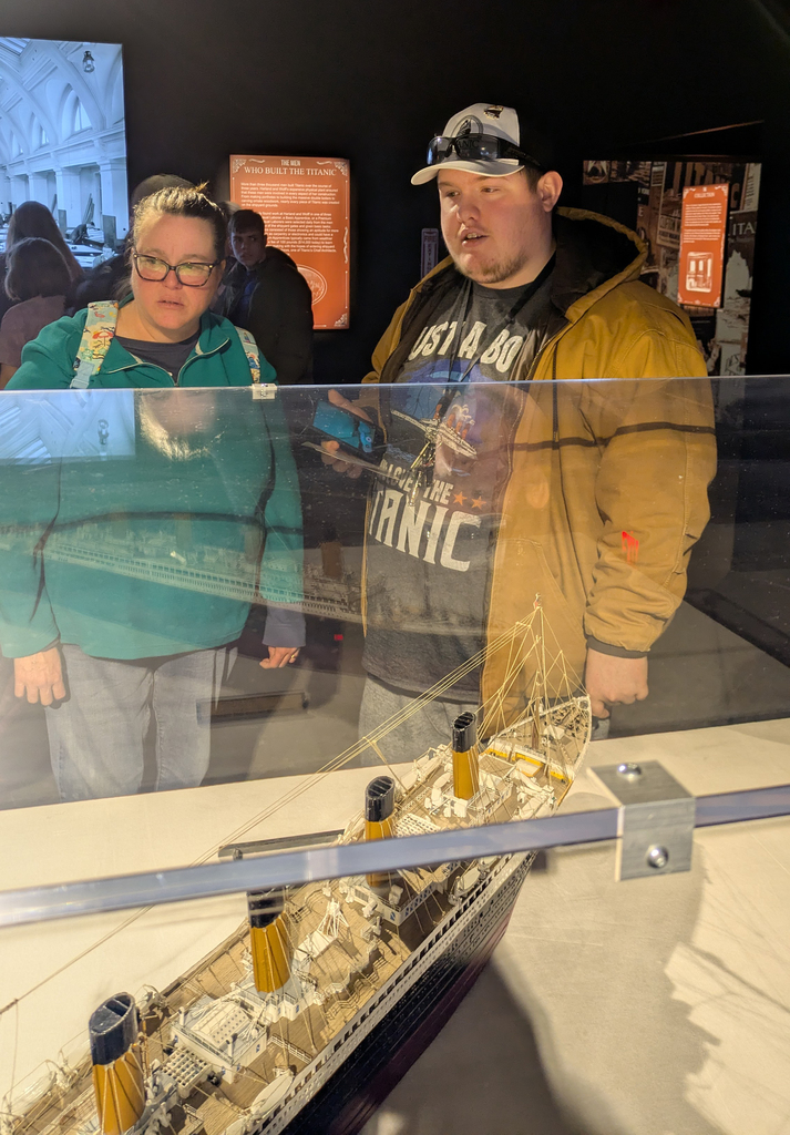 students look at model of the Titanic