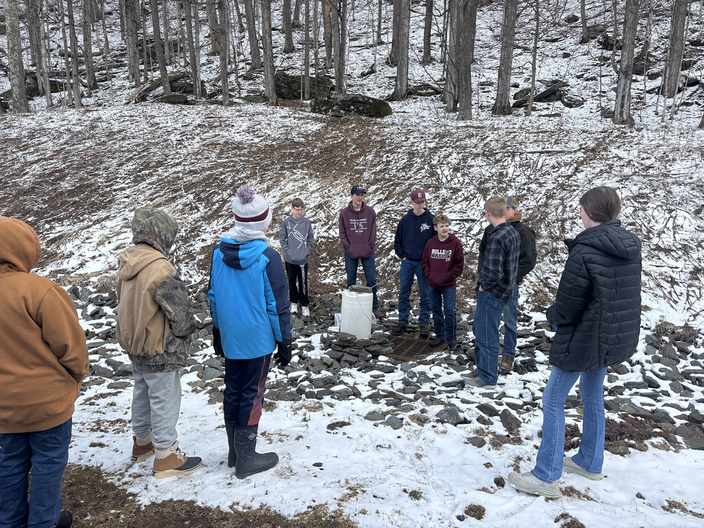 FFA member explains sap collection system to 5th graders