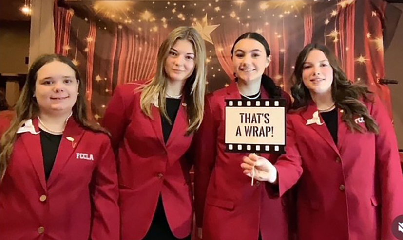 4 FCCLA students pose for a group photo