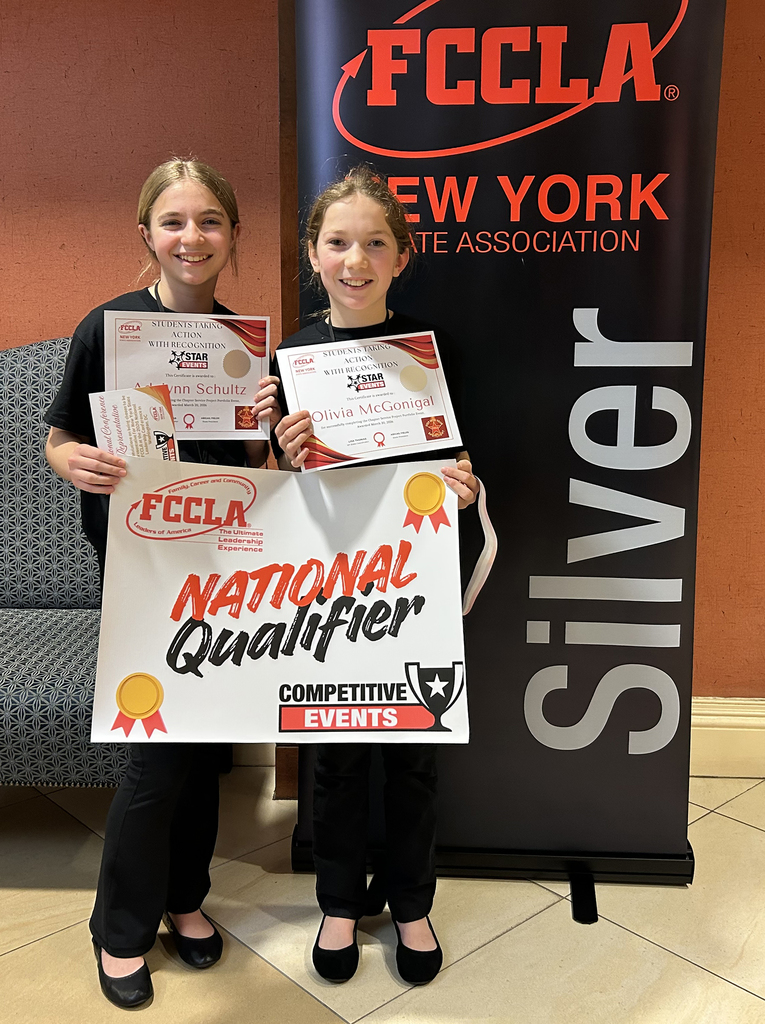 2 FCCLA members pose with their awards
