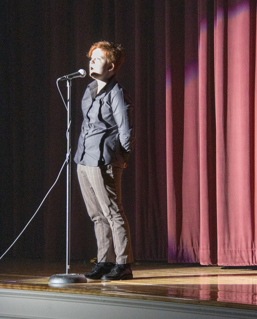 K J Synan performing a vocal solo