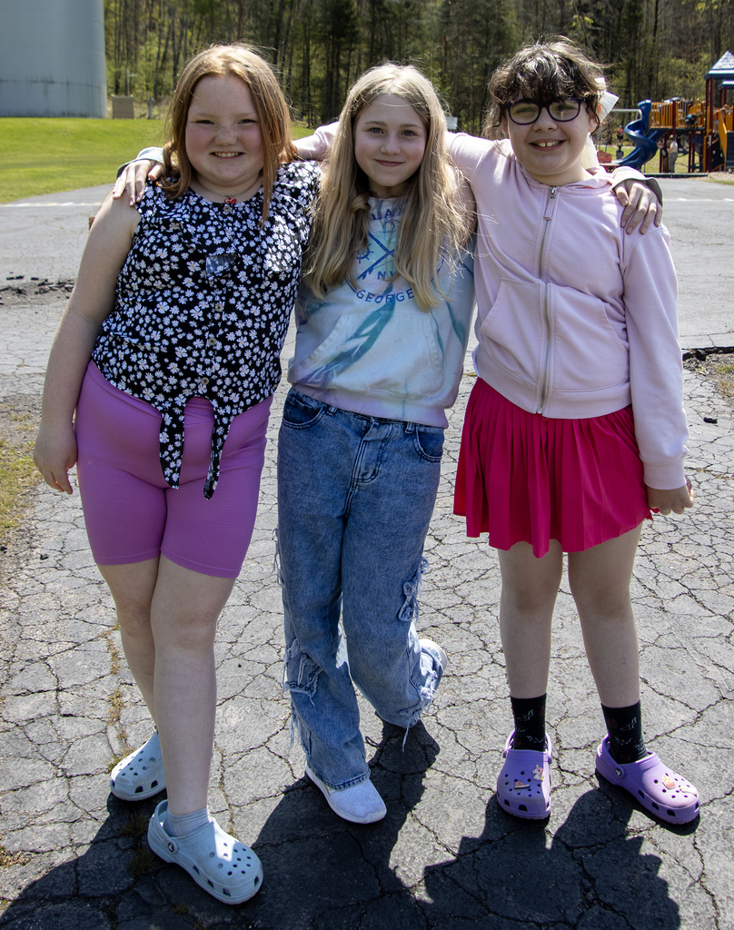 3 smiling students 
