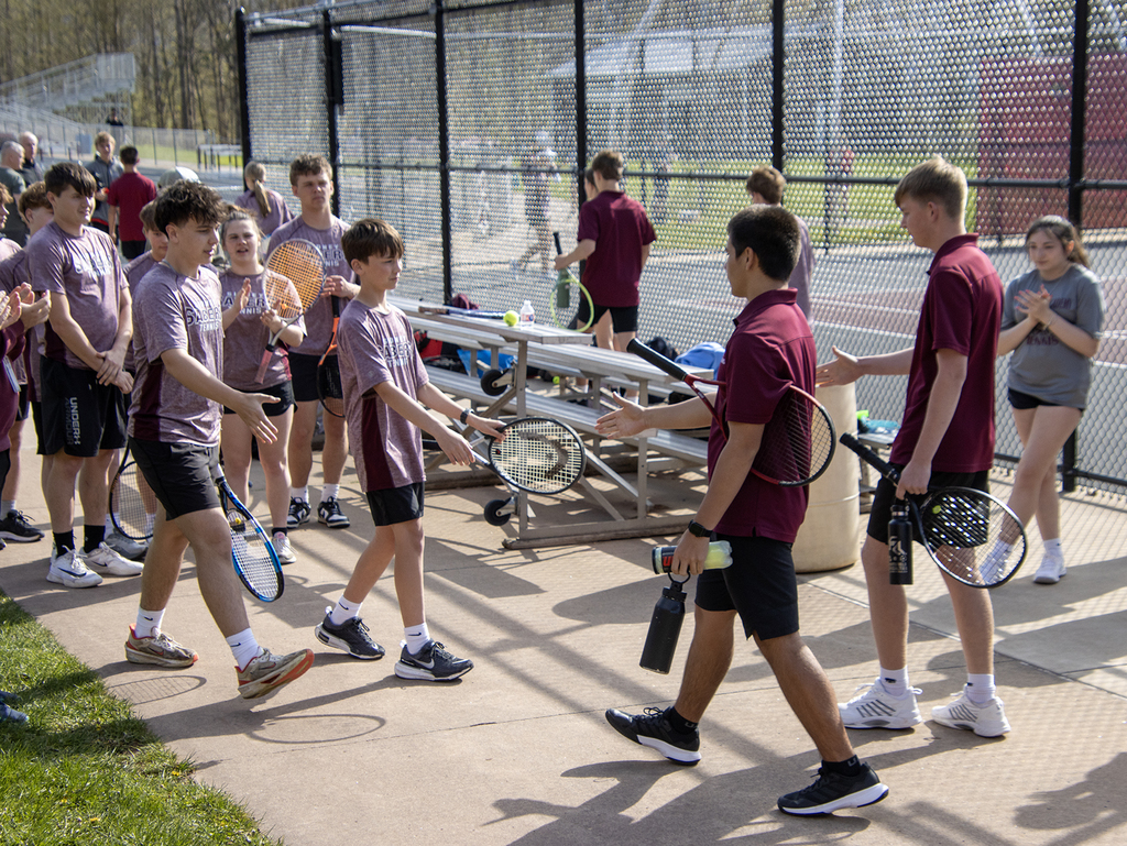 tennis players shake hands before match