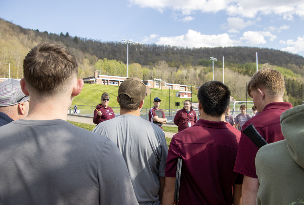 tennis coach addresses players