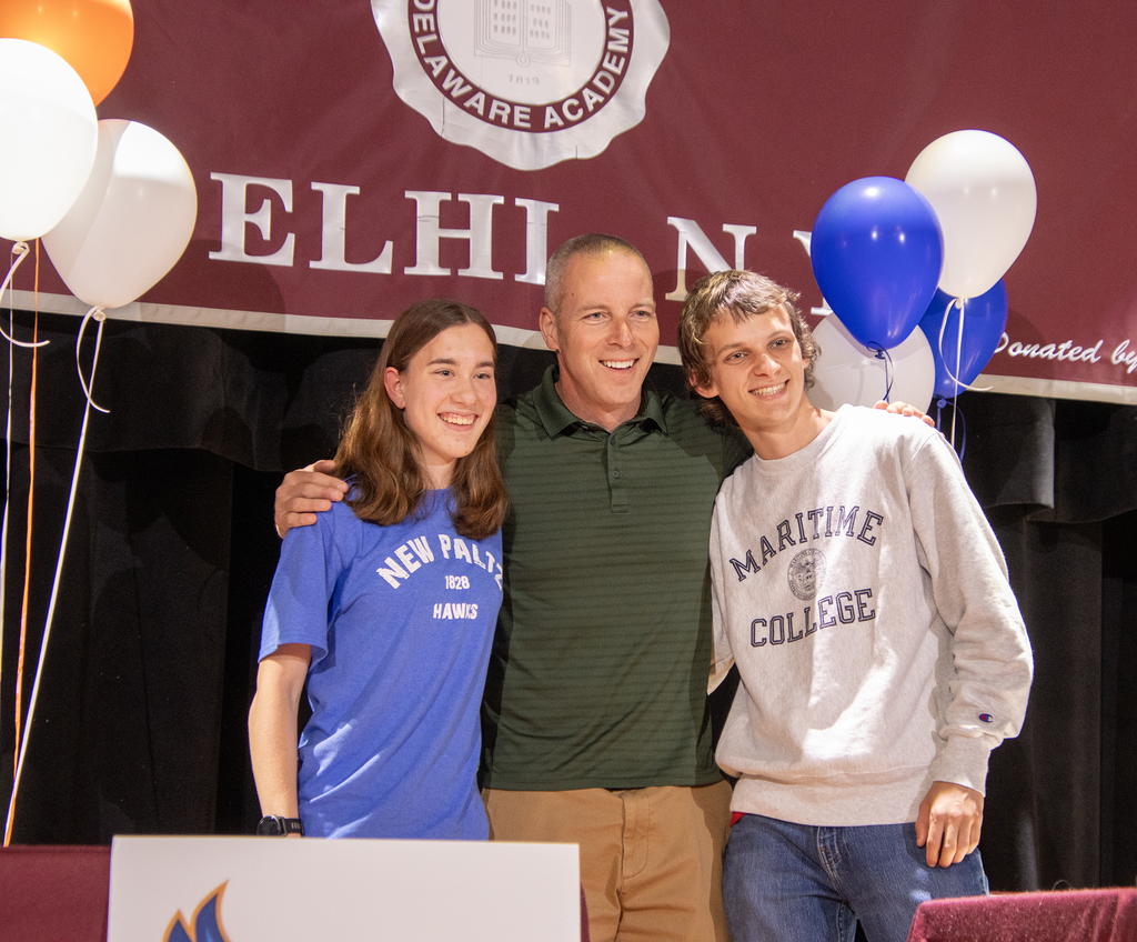 Coach Skip Bazxter poses with Olivia Kruppo and Dylan Leddy