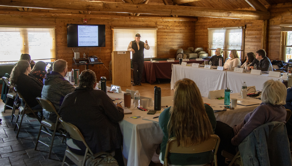 Matthew Rozell, a retired social stueies teacher turned author, speaks to the group