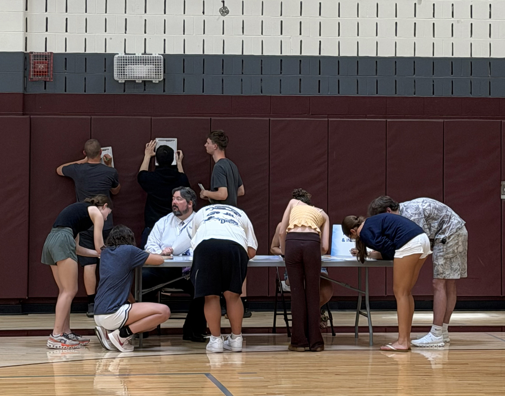 students gathered around Mr. All's table