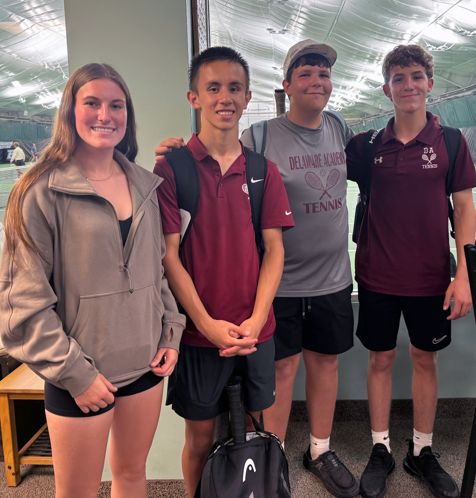 4 tennis players pose for a picture at state qualifiers