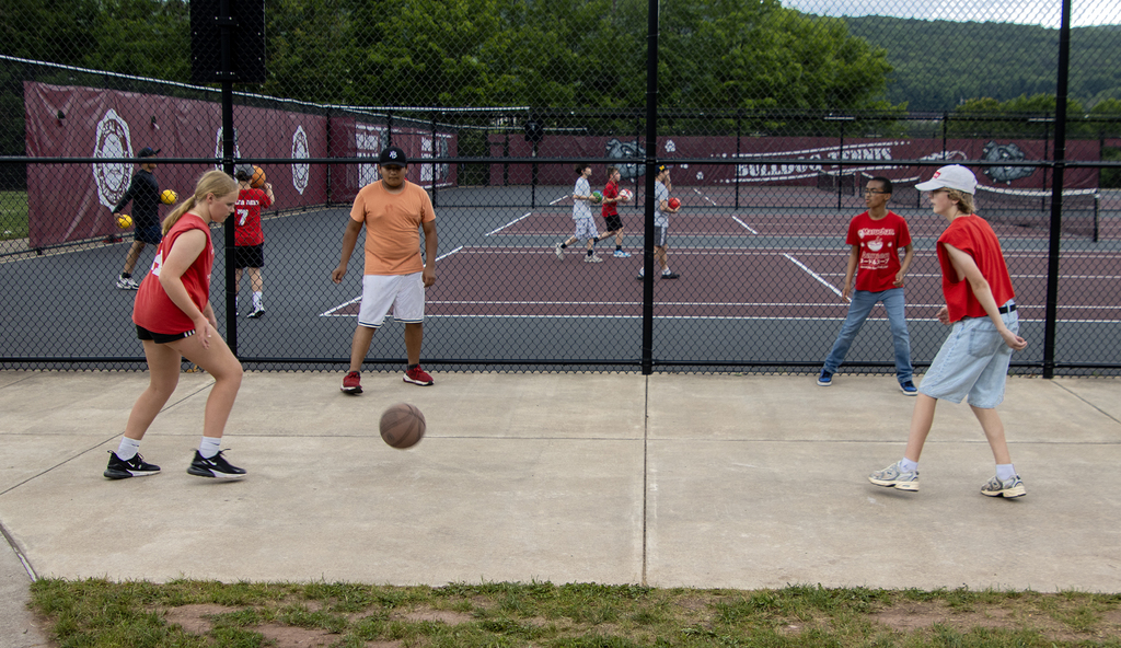 students play a kick ball game