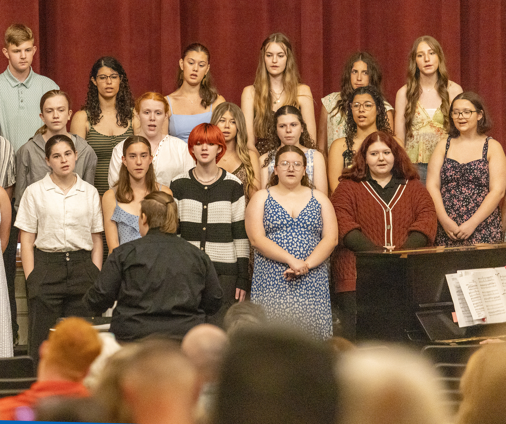 chorus members singing