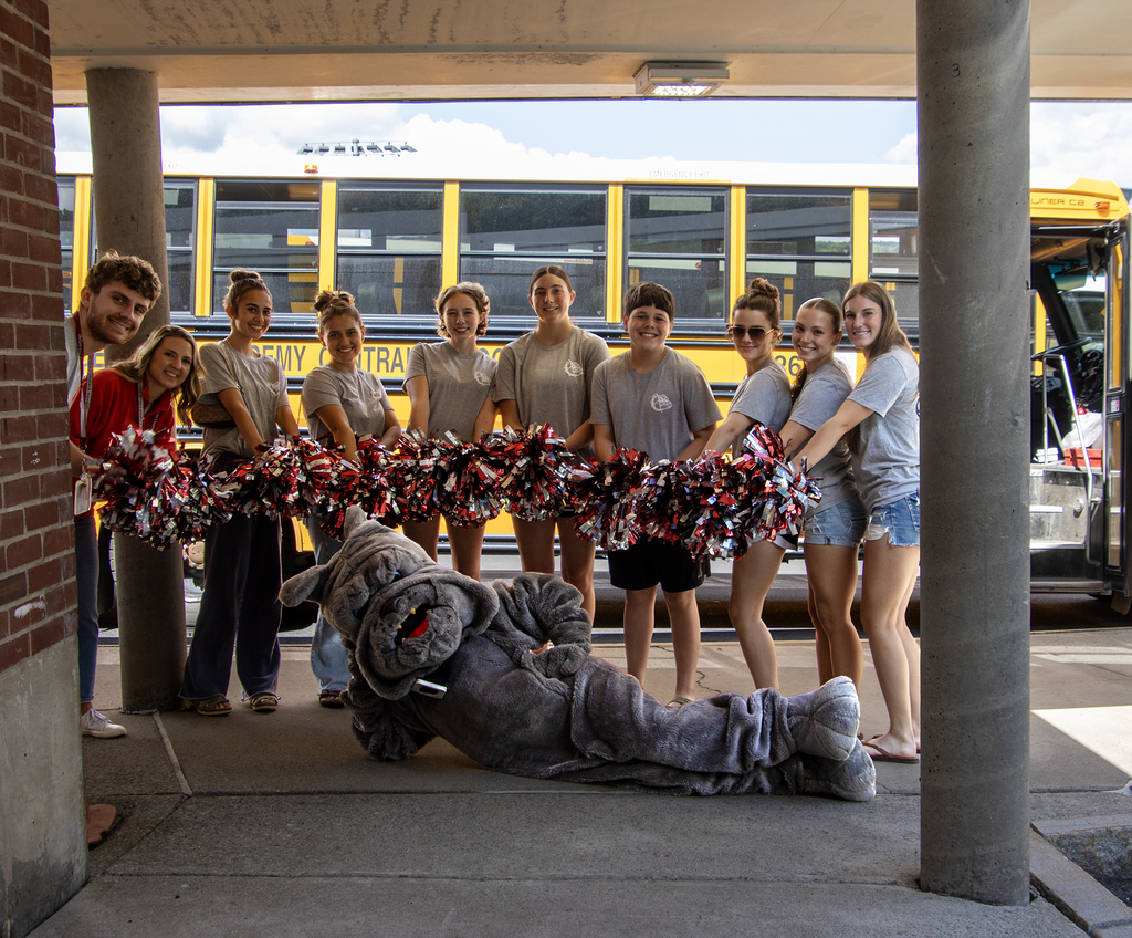 SADD students and advisors pose for a picture at the elementary school with the Bulldog mascot