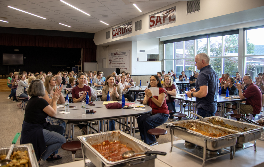 Mr. Shultz speaking to teachers and staff