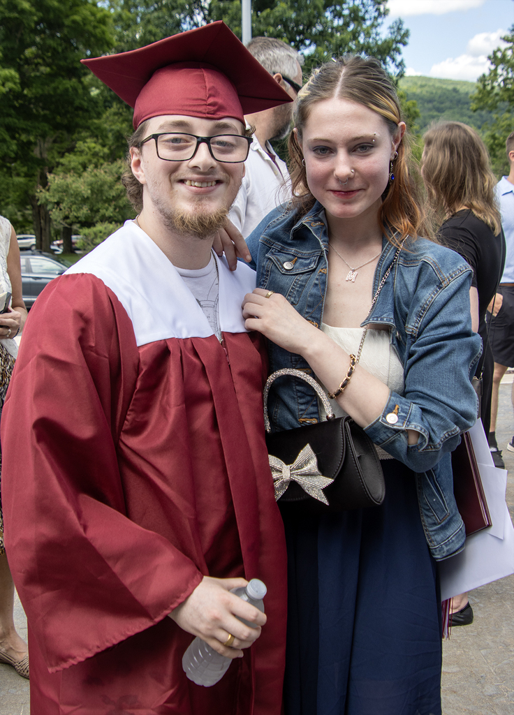 graduate posing with a friend