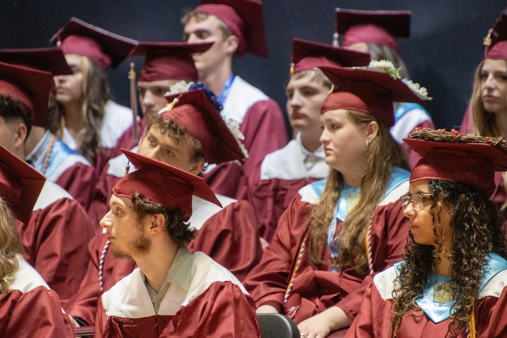graduates listening to a speaker