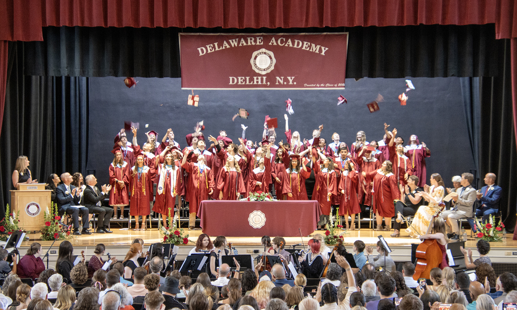 graduates toss their hats!