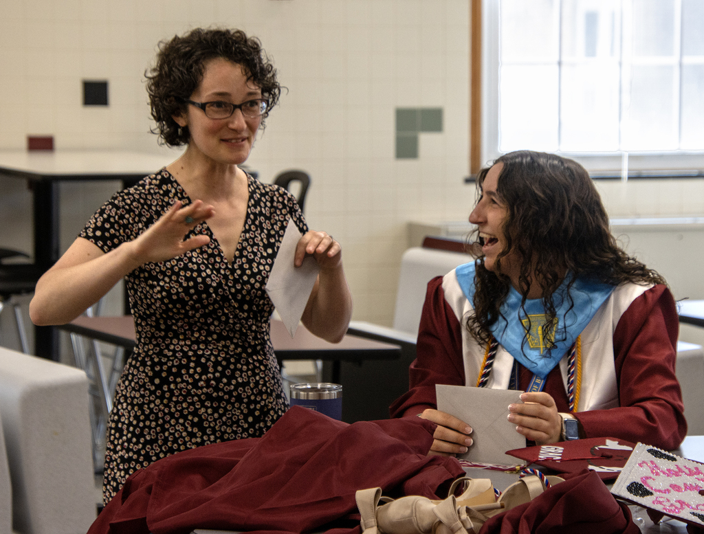Mrs. Gibson laughing with a student