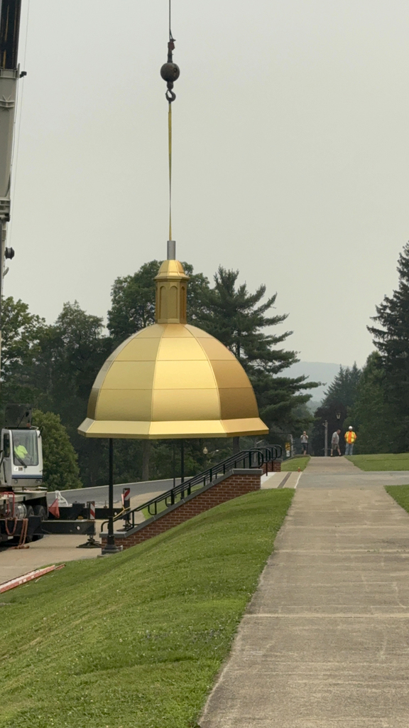 dome being moved by crane