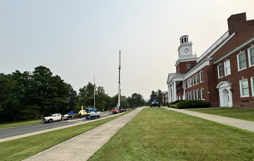 cranes in place in front of school