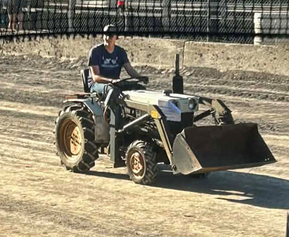 Delaware Academy student on tractor at fair