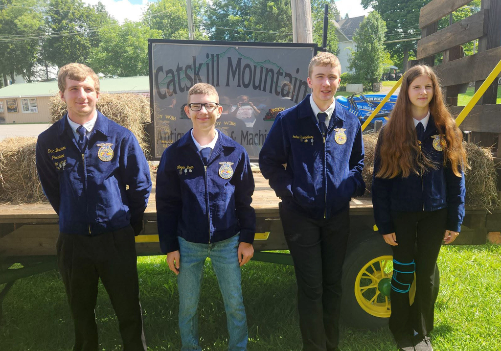 4 Delaware Academy FFA members in FFA jackets