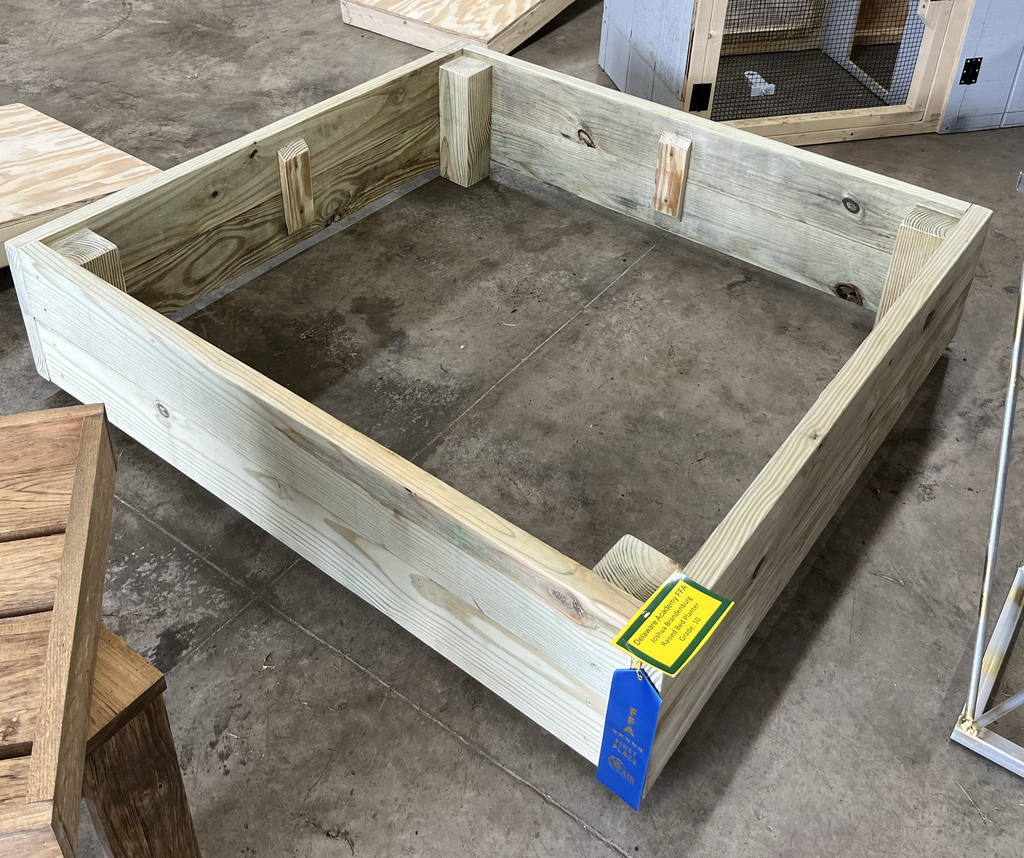 woden box with a blue ribbon on it