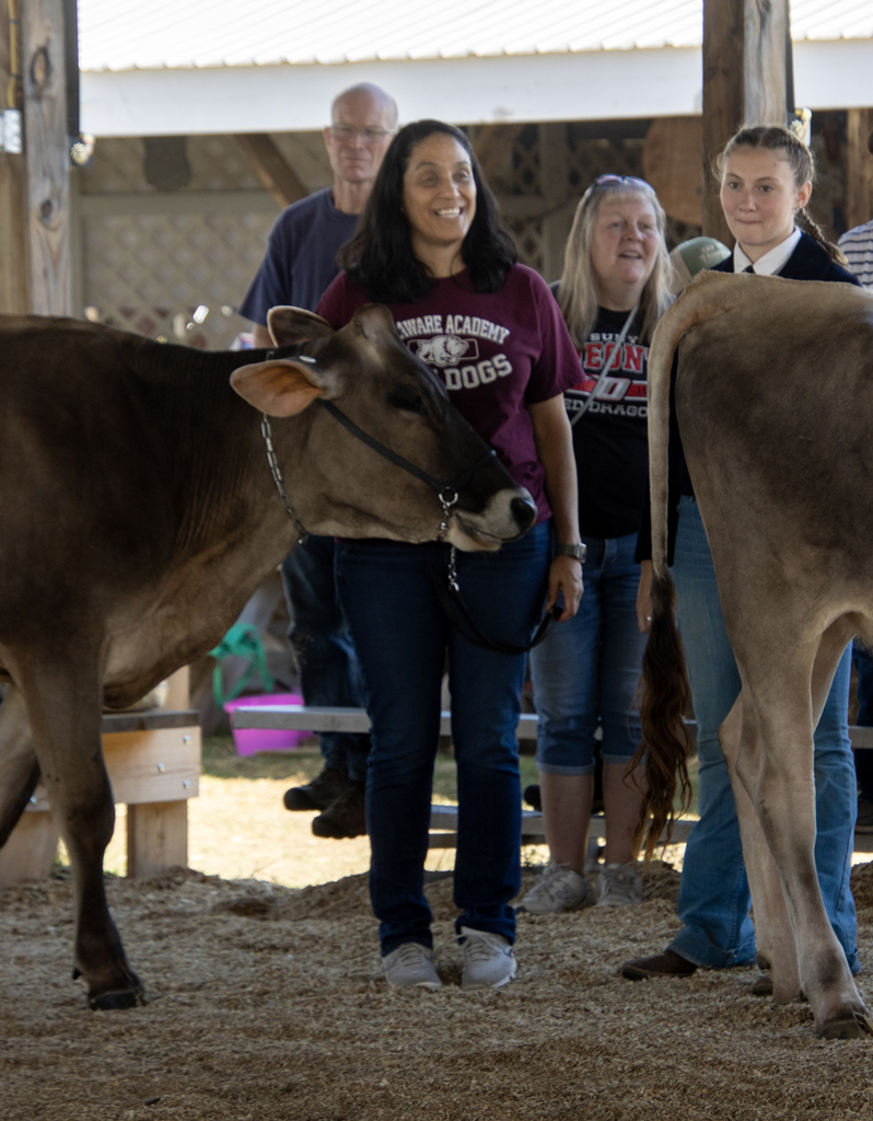 Ms. Liddle and a student in the show ring with a cow