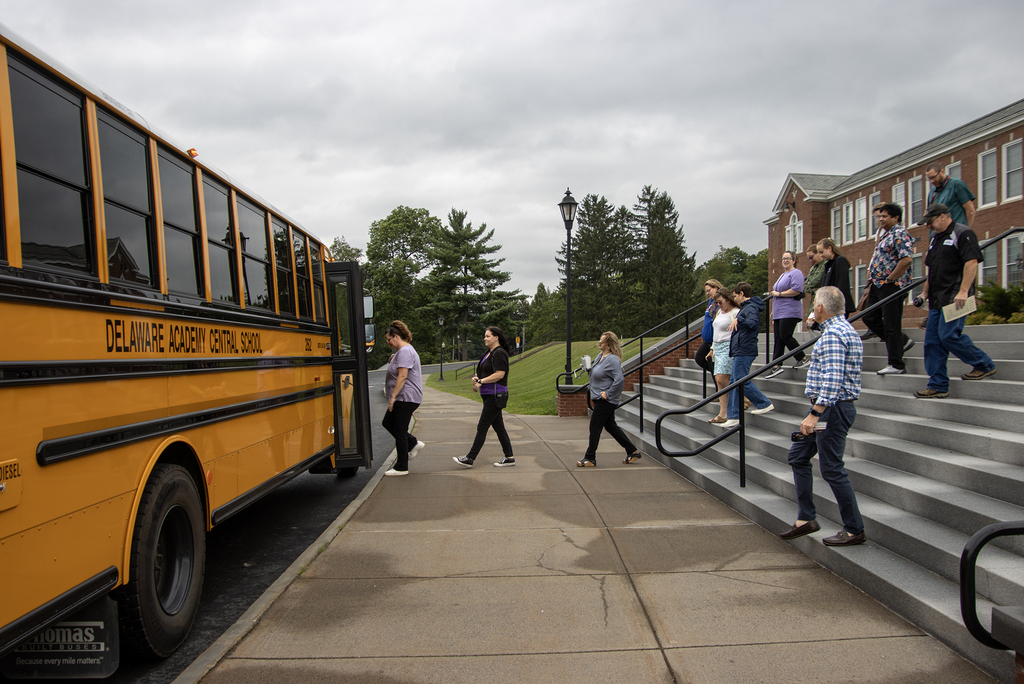 New hires getting on the school bus.