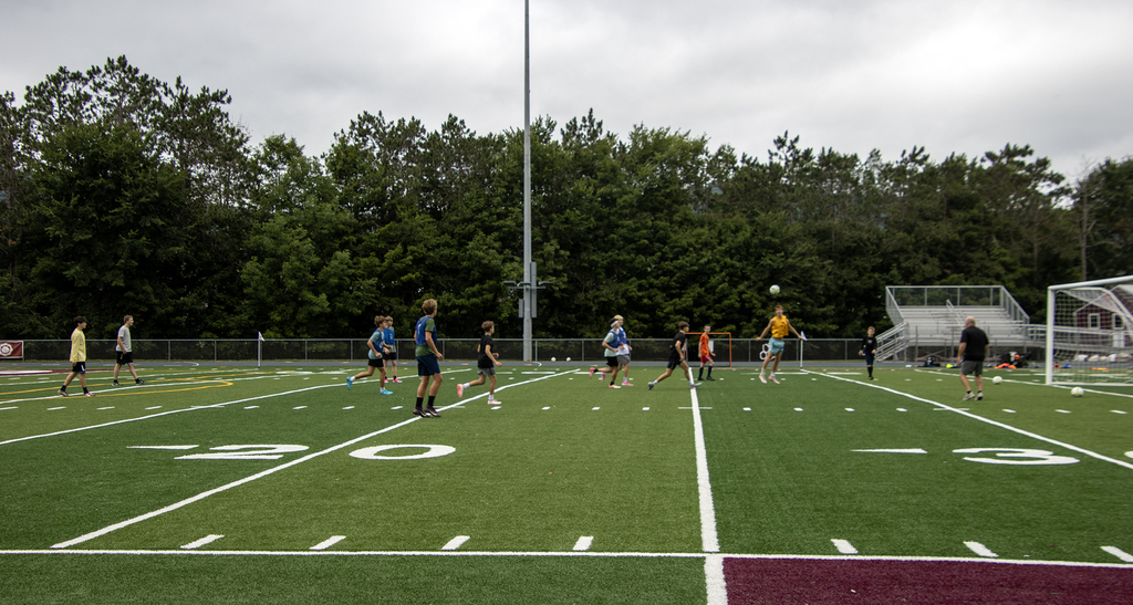 boys soccer practice taking place on Dave Kelly Field
