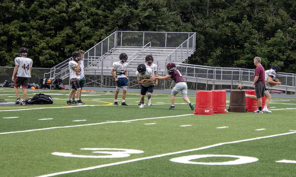 football practice taking place on Dave Kelly Field