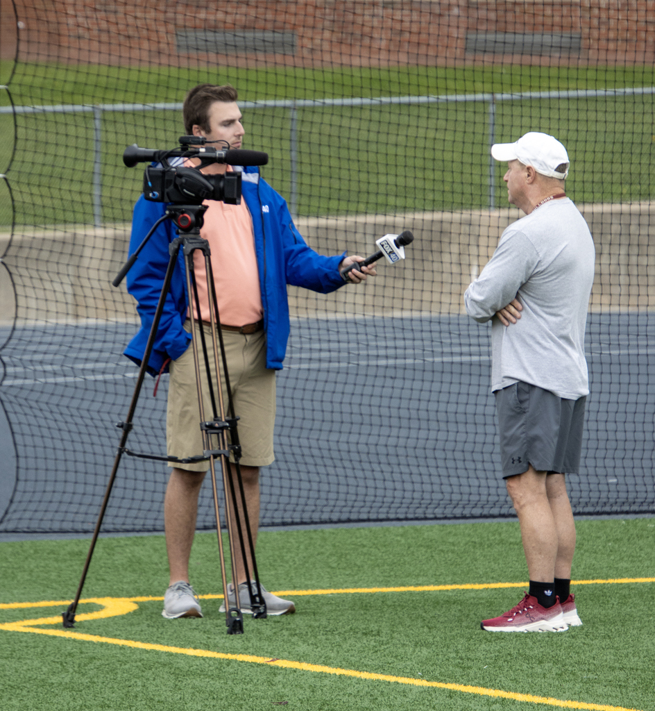 Fox News 40 reporter interviewing Coach Neumann