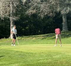 two golfers on the course