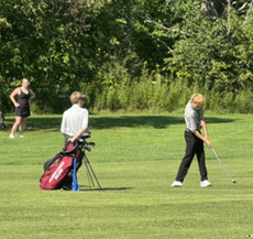 3 golfers on the course
