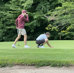 two golfers on the course