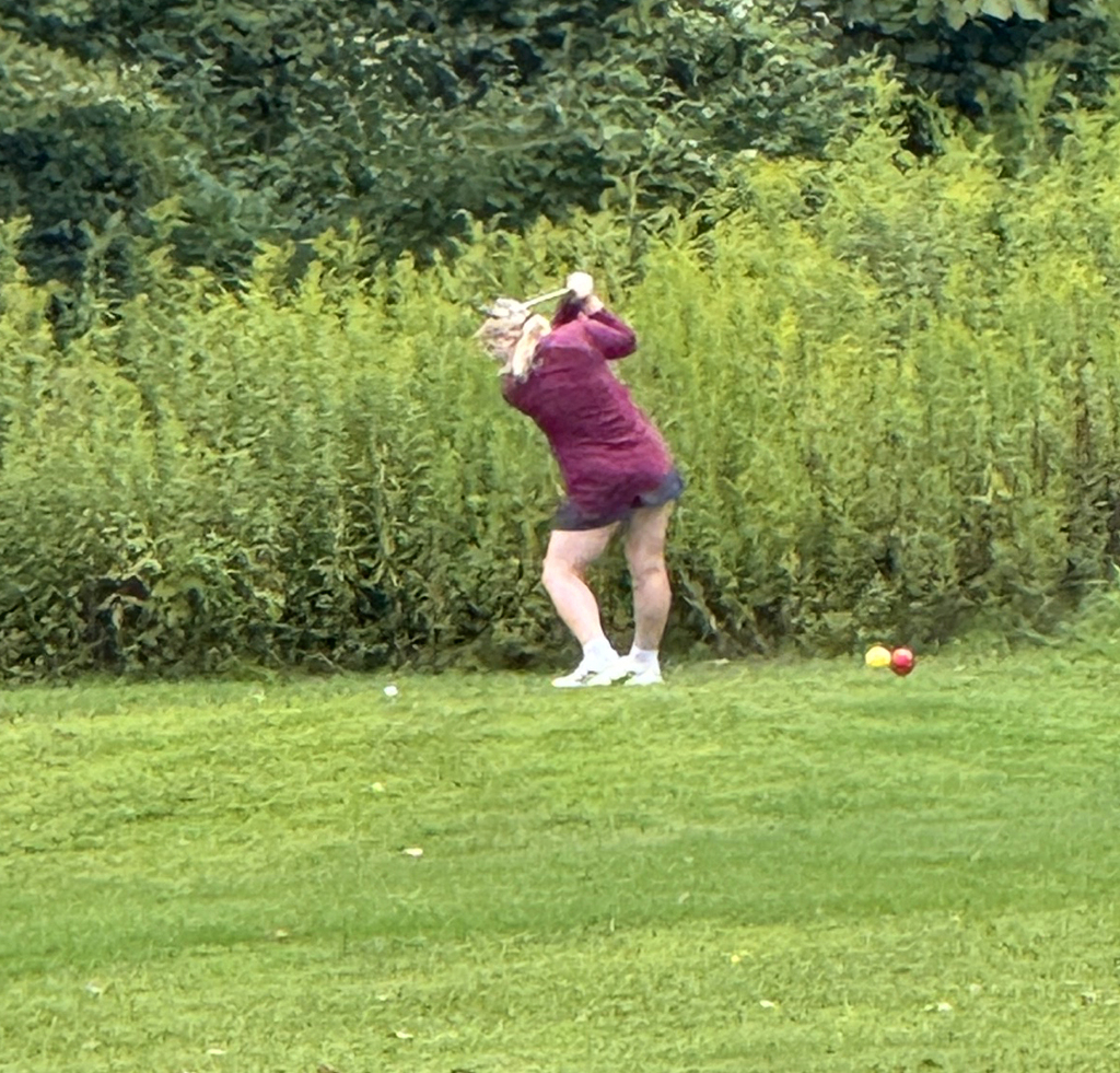 student golfing