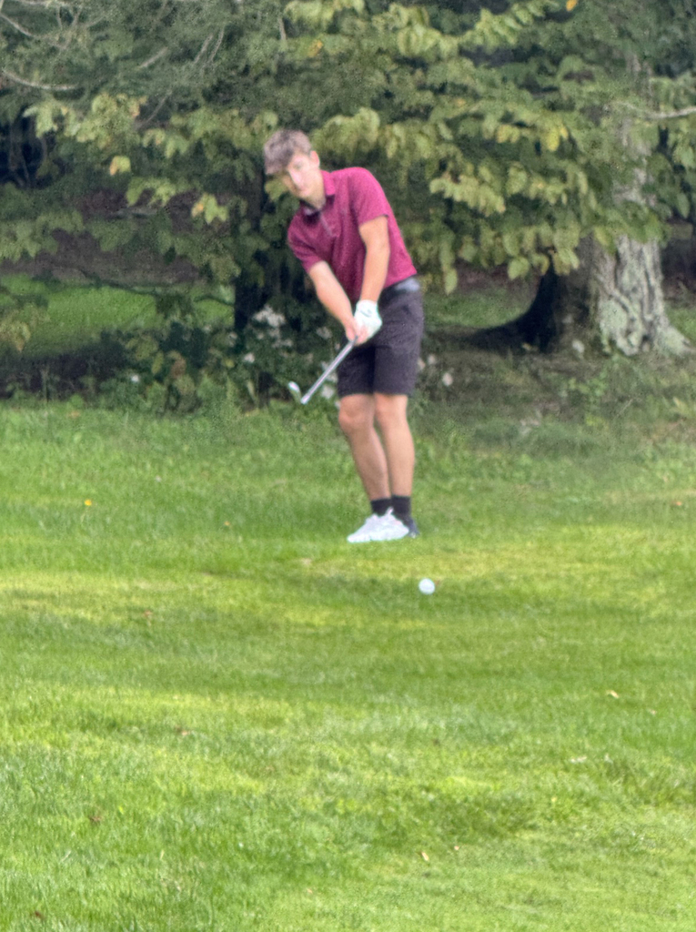 student golfing